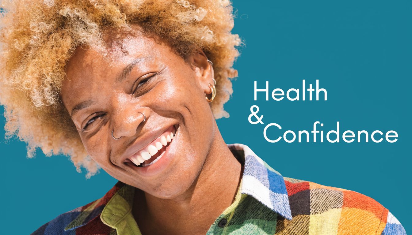 A smiling young person with curly blonde hair and colorful clothing against a bright teal background.