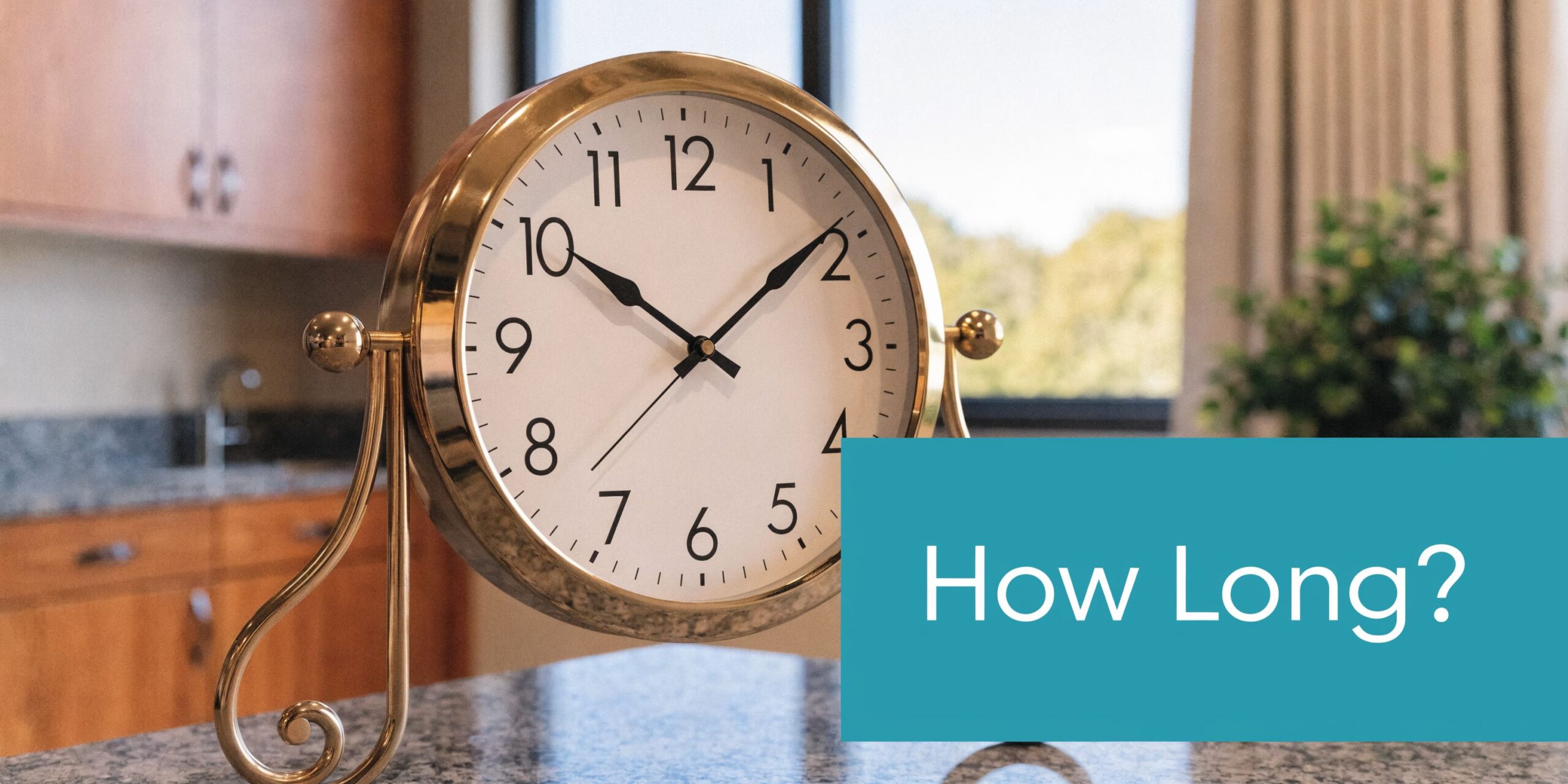 A close-up shot of a decorative round clock on a granite countertop with a teal overlay text.