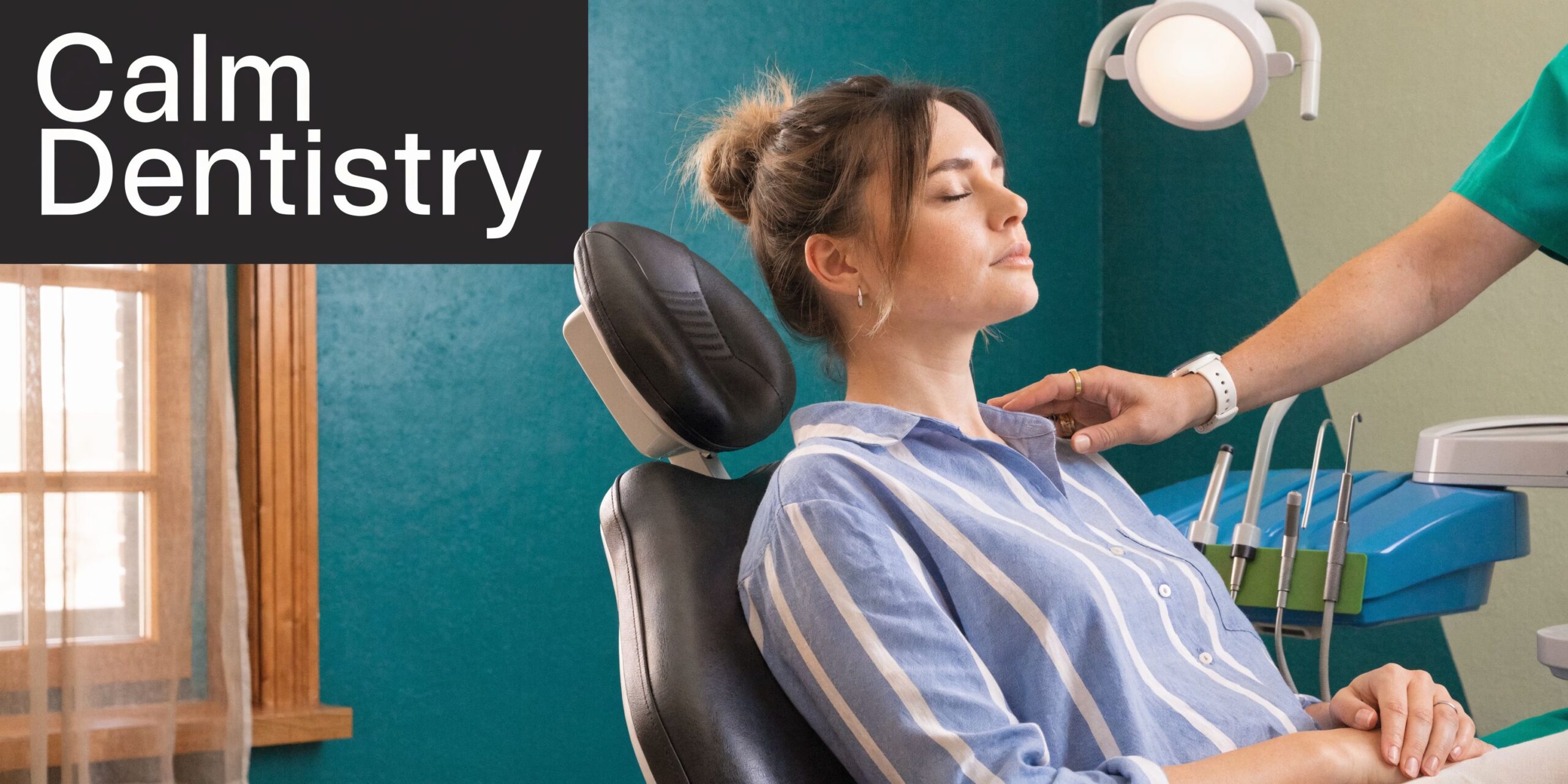 A calm woman sitting in a dental chair while a dentist gently places a hand on her shoulder.