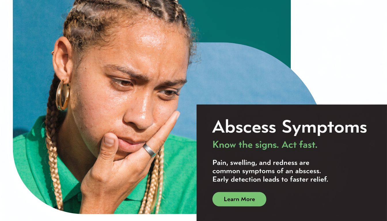 A person with braided hair touching their swollen jaw, illustrating symptoms of a dental abscess.