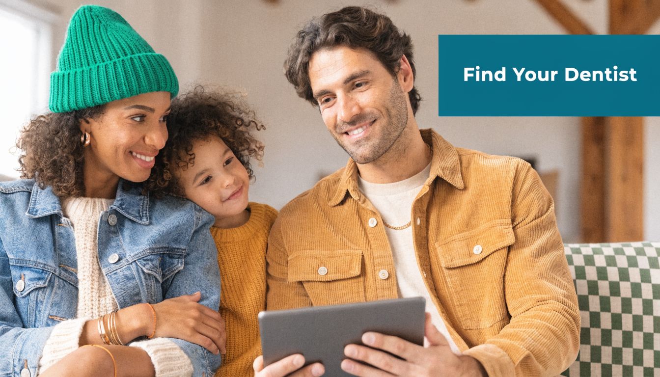 A happy family using a digital tablet together at home with a Find Your Dentist banner.