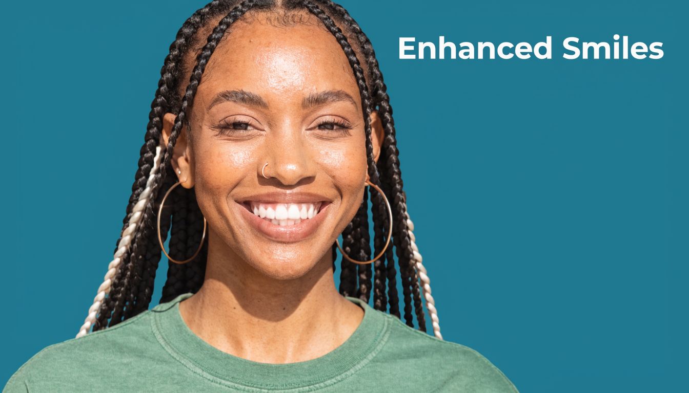 A smiling young Black woman with braided hair wearing gold hoop earrings against a teal background.