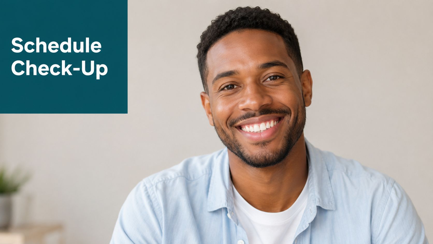 A friendly man with a warm smile looking at the camera next to a Schedule Check-Up sign.