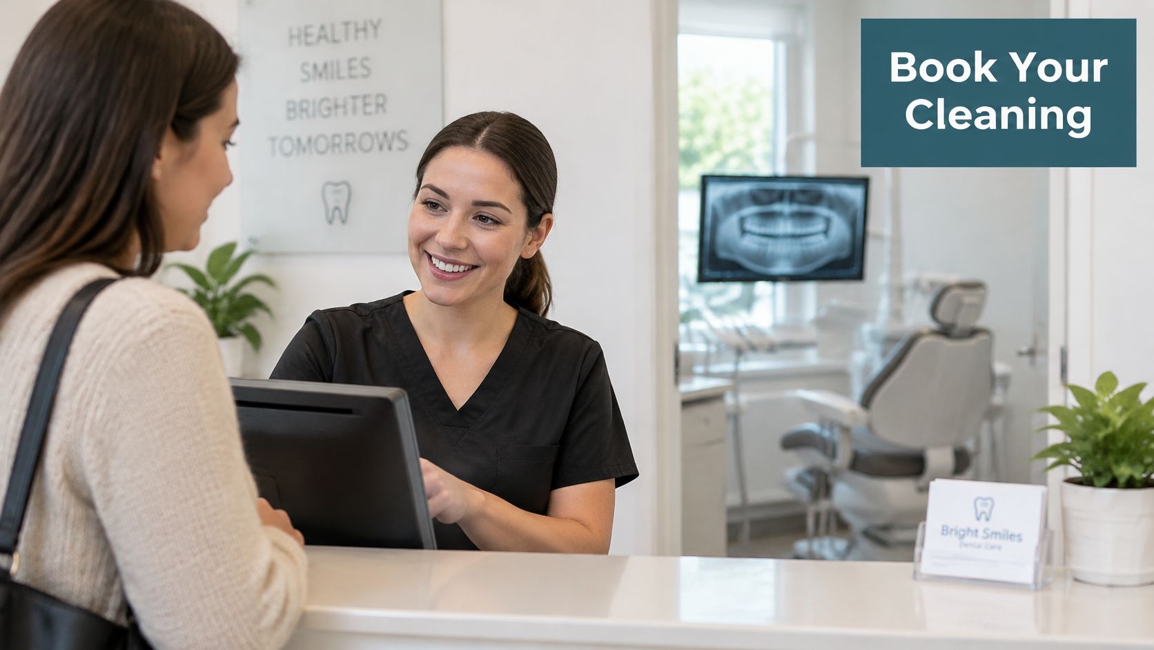 A friendly dental receptionist smiling at a patient while assisting with their appointment booking at the counter.