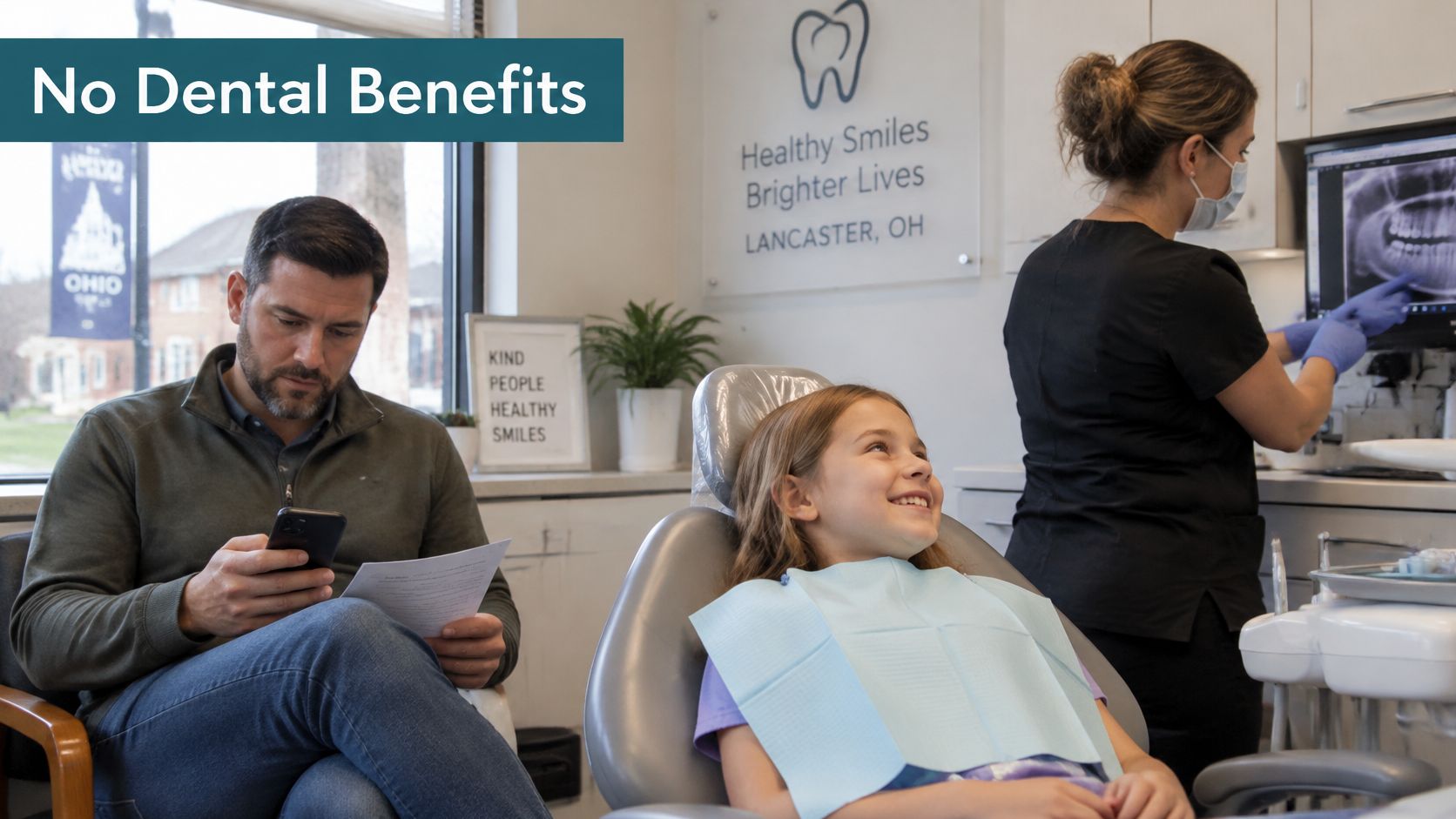 A girl sitting in a dental chair smiling while a father reviews paperwork in a dental office.
