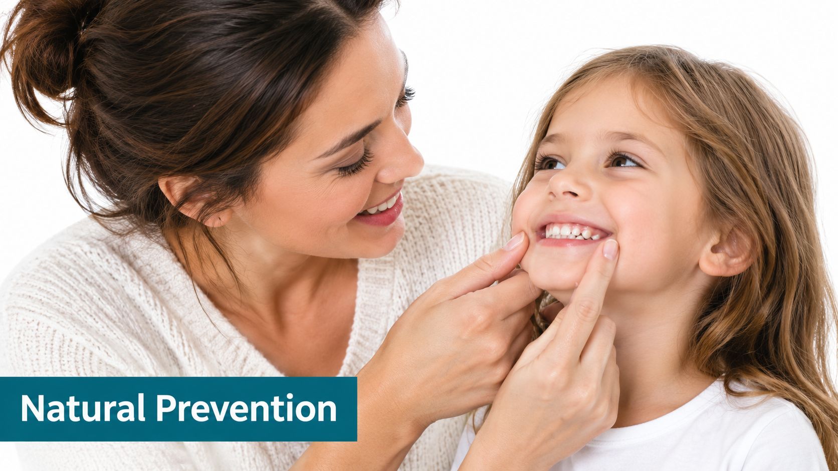 A caring mother gently examines her young daughter's teeth to promote natural dental cavity prevention techniques.